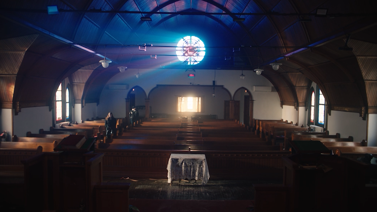 An empty church interior in Beside the Sky