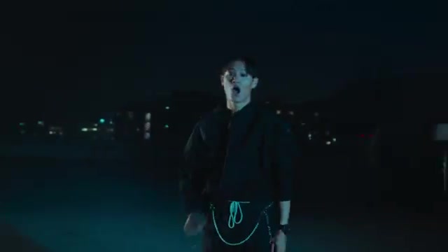 Red-lit performance frame from ON TOUR